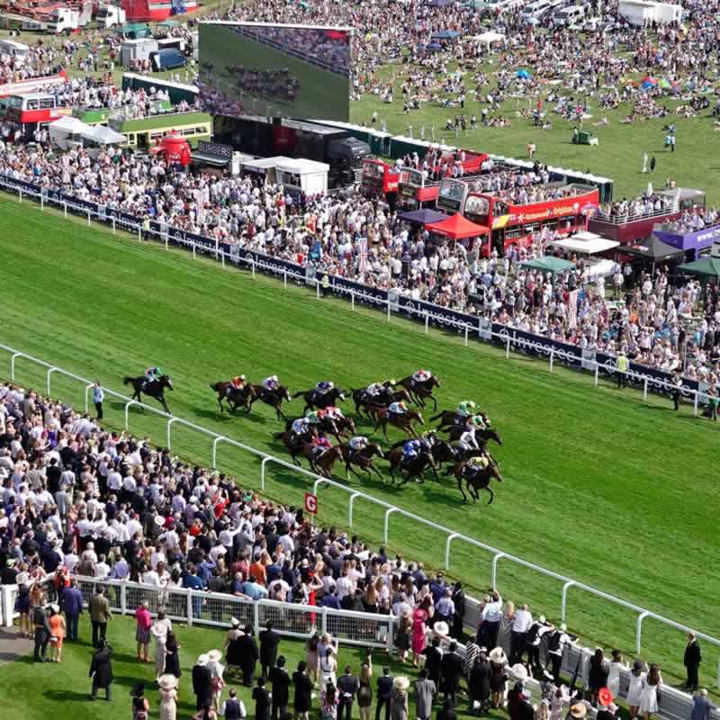 Racegoers at Epsom Downs center course enclosures on Derby Day