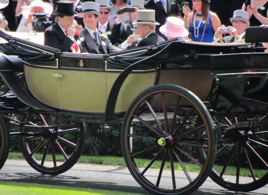 HM The Queen and (the late) Prince Philip arrive at the Epsom Derby in an open-topped horse-drawn carriage
